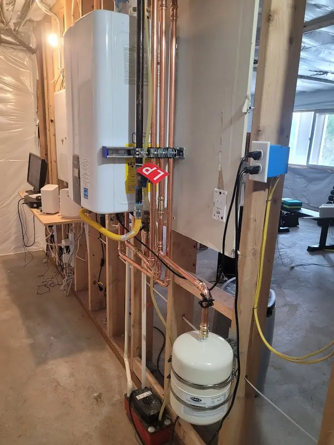 Licensed plumber repairing a kitchen sink in Bear